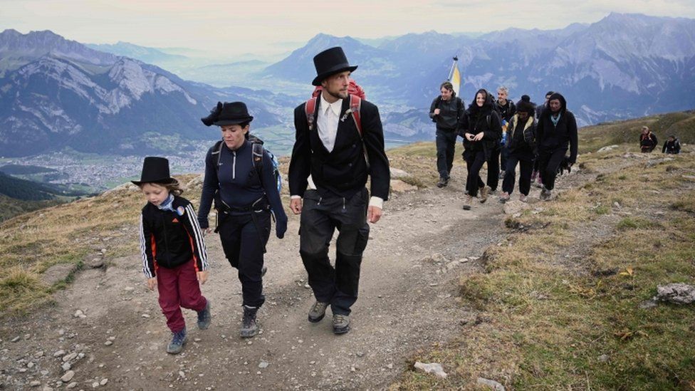 Swiss people participate in “funeral march” commemorating Pizol glacier